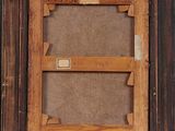 an old picture frame with a picture of a man and a woman