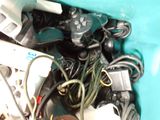 a blue container filled with assorted electronics and wires