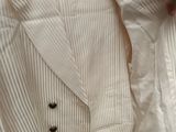 a person holding a white shirt and a white jacket