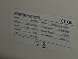 a close up of a white refrigerator with a label on it