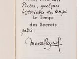 an open book with a handwritten poem on it