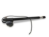 black and white photo of a pen with a cord attached to it