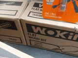 three boxes of tools sitting on a table next to each other