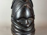 an image of a black mask on a stand