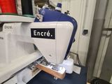 a sewing machine that is on a table in a room