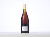 a bottle of wine that is sitting on a table