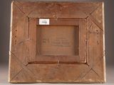 an old wooden picture frame sitting on top of a table