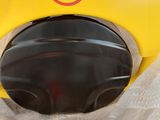 a yellow helmet with a no parking sign on it