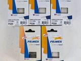 quatre boîtes de chiffons de nettoyage Primex posées sur une surface blanche
