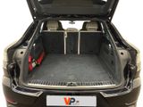 the back of a car with the trunk open and the seats folded down