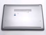 a silver laptop with a blue button on it