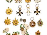 a group of twelve pairs of gold and enamel starbursts