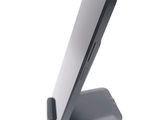 a cell phone on a stand on a white surface