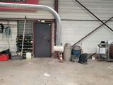 a garage with a door and a sign on the wall
