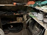 many wires and hoses on the shelves in the room