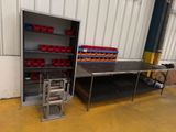 two tables and a shelf in a warehouse