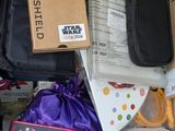 a pile of electronic gadgets and other items in a box