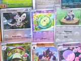 a lot of pokemon cards that are on the table
