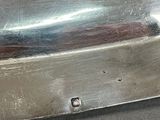 a piece of metal that is sitting on top of a table