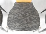 an image of a close up of a chair with a yellow seat