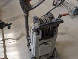 a machine that is sitting on the floor in a garage