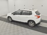 a picture of a white car parked in a garage