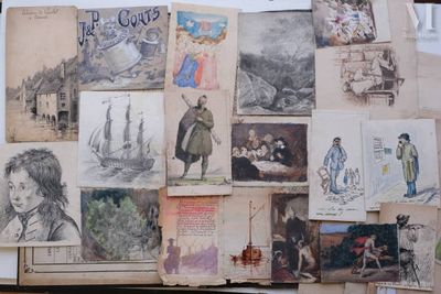 many drawings on the wall of a room