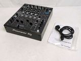 a close up of a dj controller with a cable and a bag