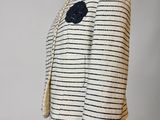 a white and black striped jacket on a mannequin mannequin mannequin mannequin mannequin mannequin mannequin mannequin