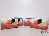 three boxes of foot care products sitting on a table