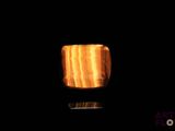 a candle that is lit up in the dark