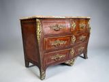 an antique chest of drawers with marble top