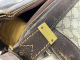 a close up of a purse with a tag on it