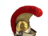 a red and gold helmet on a white background