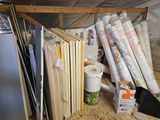 many rolls of paper on a shelf in a room