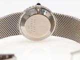 an image of a close up of a wrist watch on a white surface