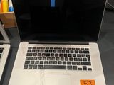 two laptops that are sitting on a table