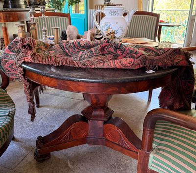 a table with a cloth on it in the middle of a room