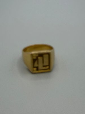 a picture of a gold signet ring with the letter k on it