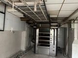 an empty room with a lot of windows and a door