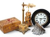 a clock that is sitting next to a box and a clock