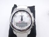 a close up of a wrist watch on a pillow