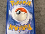 a close up of a pokemon book on a table