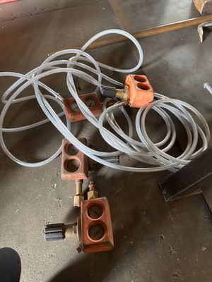a bunch of hoses on the floor next to a fire hydrant