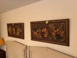 two paintings on the wall above a bed in a bedroom