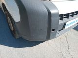 a close up of the front bumper of a white truck