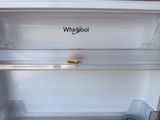 an empty refrigerator with the door open and the contents in it