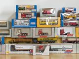 many different types of toy trains on display in the room