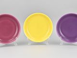 three different colored plates sitting on top of each other
