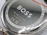 a close up of a watch on a white surface